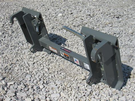 add a powered quick attach to a skid steer|universal skid steer quick hitch.